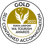 An image of a badge showing Tree Chalets Gold Medal win for self catering accommodation in the 2022 Western Australian Tourism Awards