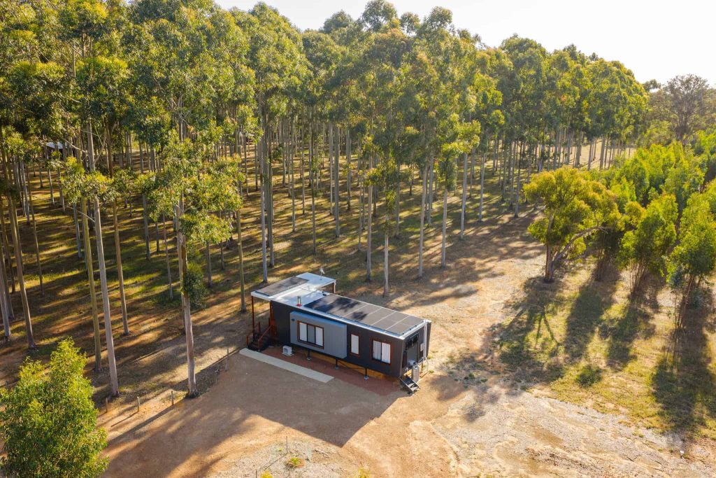 Aerial view of Chalet Grandis at Tree Chalets, an adult-only luxury eco-chalet surrounded by towering rose gum trees in Busselton, offering a private and serene nature escape.