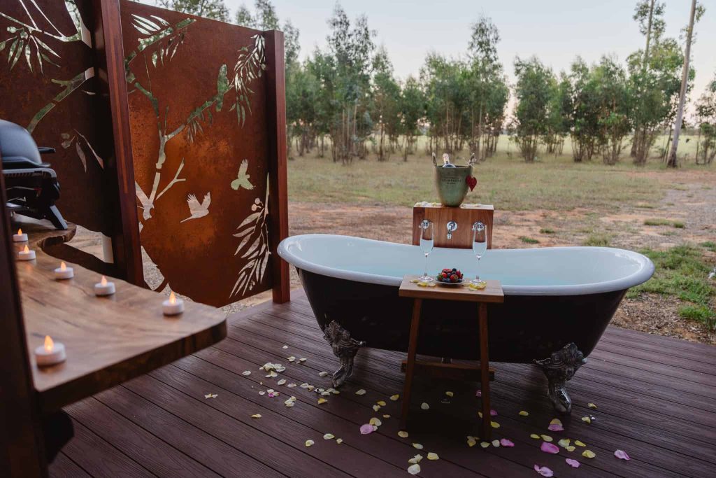 Open-air bath deck at Chalet Grandis, Tree Chalets, designed for romantic stargazing and quiet moments in the surrounding rose gum forest